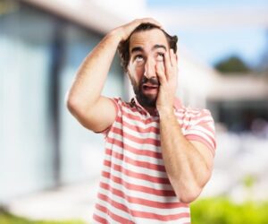 Man receiving a professional hair loss treatment at GQ Men’s Hair Lounge.